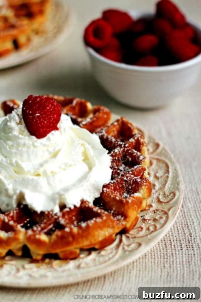 Sunday Morning Waffle Perfection 6 Close-up of golden brown waffles with a drizzle of maple syrup