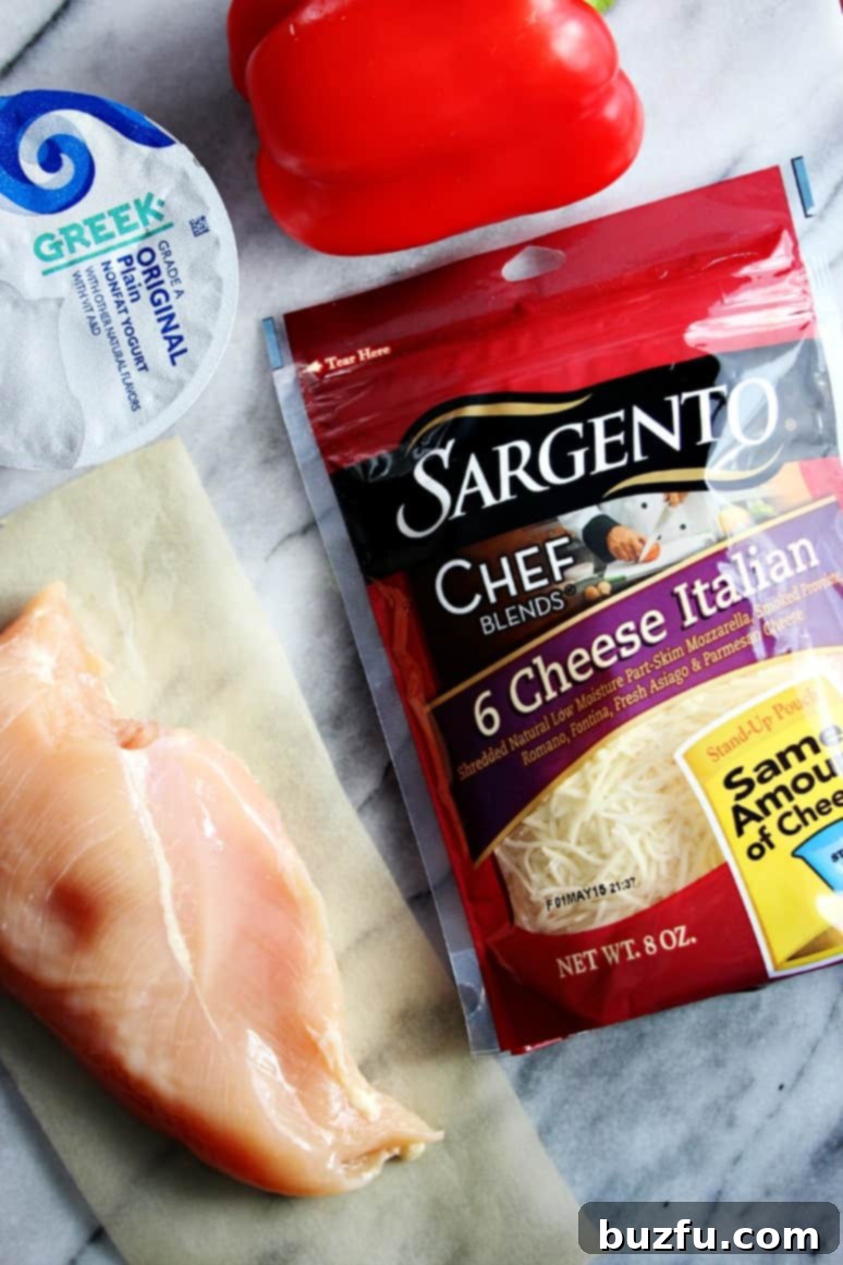 Fresh ingredients for Italian Chicken Cheesy Bread including Sargento cheese, chicken, red pepper, and tomatoes.