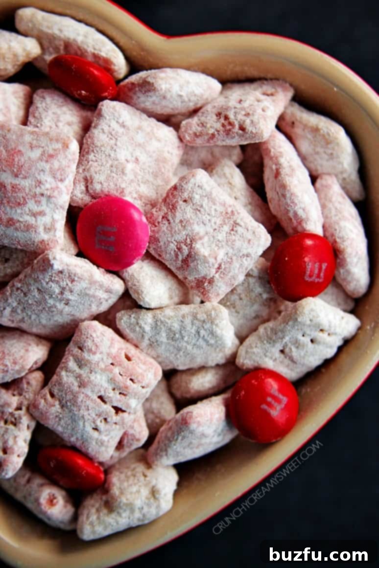 Close-up of Valentine's Day Puppy Chow on a white surface, perfect for sharing