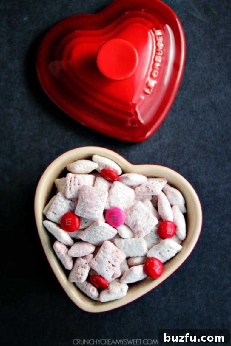 Valentine's Day Puppy Chow with a mix of red and pink M&M's
