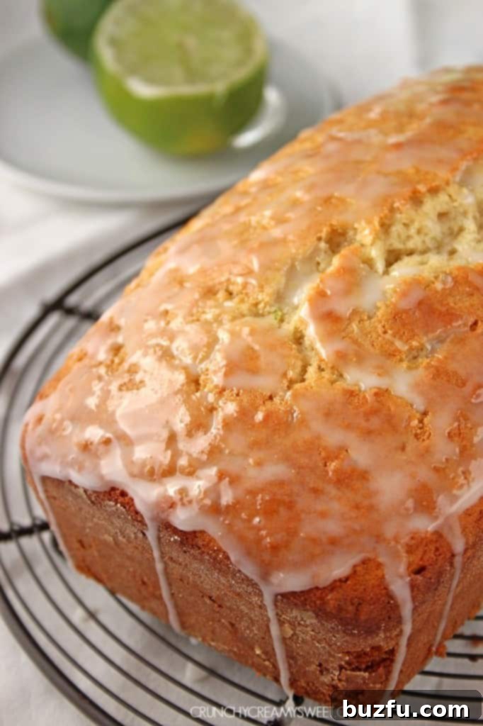 Glazed Coconut Lime Loaf Cake, sliced and ready to serve