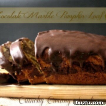 Swirled Chocolate Pumpkin Harvest Loaf 3 A top-down view of a Chocolate Marble Pumpkin Loaf Cake, sliced to reveal the beautiful marbled pattern, with a rich chocolate glaze dripping down the sides.
