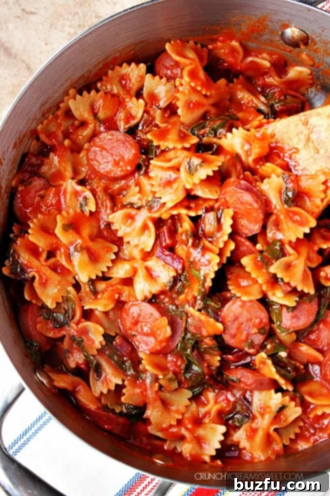 Saucy Pasta with Sausage and Beet Greens, a quick one-pot, gluten-free recipe.