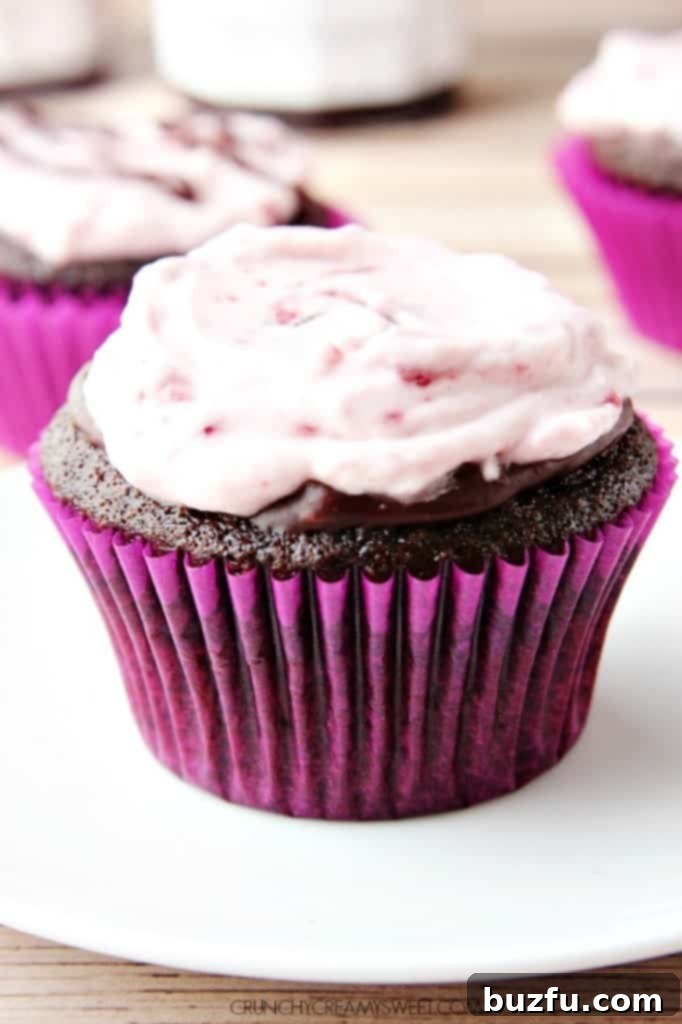 Decadent Cherry Cream Chocolate Cupcakes with a hint of cherry preserves cream frosting on top, perfect for a Mother's Day celebration.