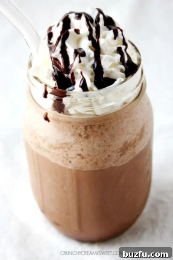 Close-up of a Homemade Mocha Frappuccino, showing its smooth texture and rich color, ready to be enjoyed.