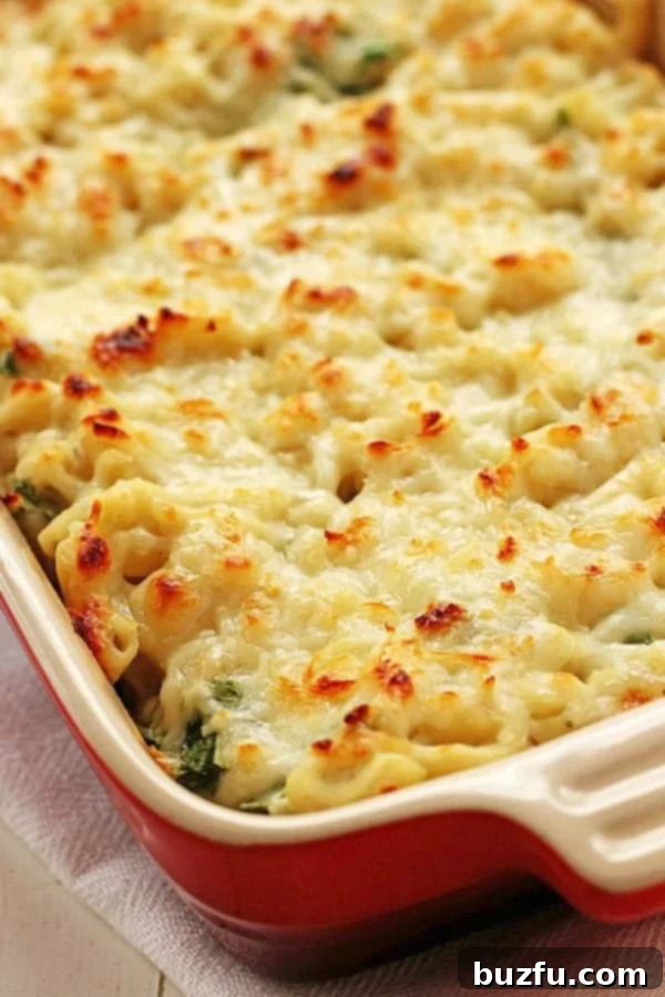 Healthy Spinach Dip Mac and Cheese in casserole dish, ready to be served.