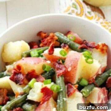 Hearty Green Bean Potato Salad with Crispy Bacon 2 Potato Salad with Green Beans and Bacon in a bowl.