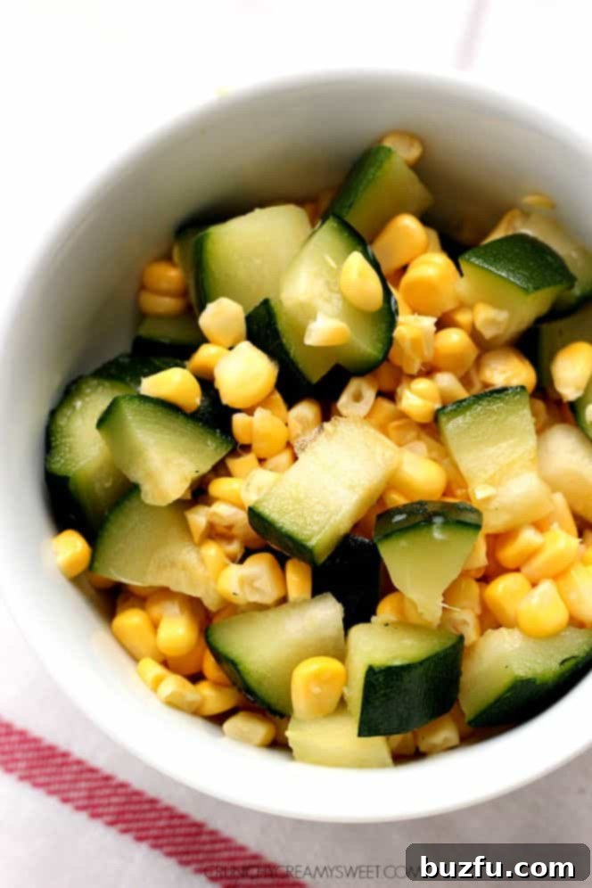 A selection of fresh corn and zucchini, along with bacon strips, indicating ingredients for the pasta dish.