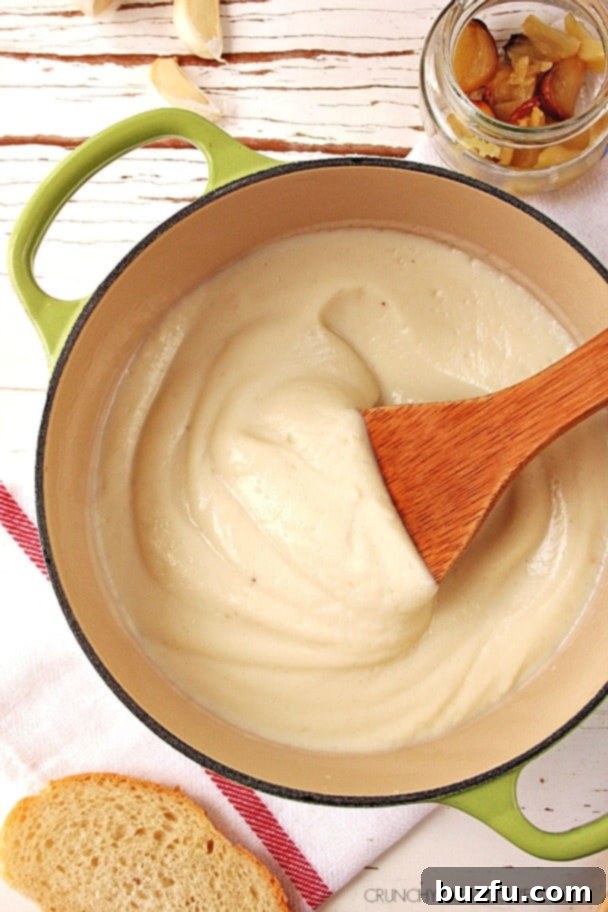 Creamy Roasted Garlic Cauliflower Alfredo Sauce in a pan, a healthy alternative.