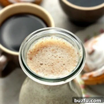 Cinnamon Roll Bliss Coffee Creamer 2 Homemade Cinnamon Roll Coffee Creamer next to coffee.