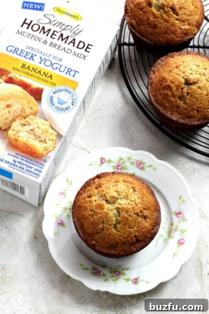 Cinnamon Swirl Peanut Butter Banana Muffins - soft and fluffy banana muffins with a surprise cinnamon swirl and peanut butter chips. Close-up shot of Cinnamon Swirl Peanut Butter Banana Muffins, highlighting the peanut butter chips and cinnamon swirl.