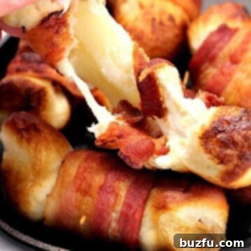 Irresistible Bacon Cheese Bombs 2 Bacon wrapped cheese bombs in small cast iron skillet.