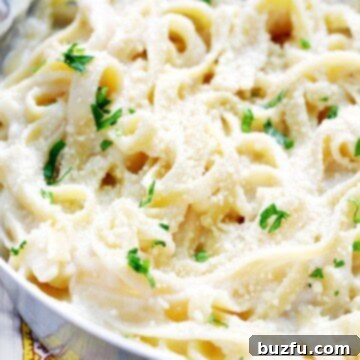 Guilt-Free Fettuccine Alfredo 2 Skinny Fettuccine Alfredo in a pan.