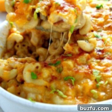 Decadent Queso Mac and Cheese with Crispy Bacon 2 Queso mac and cheese in white baking casserole dish.