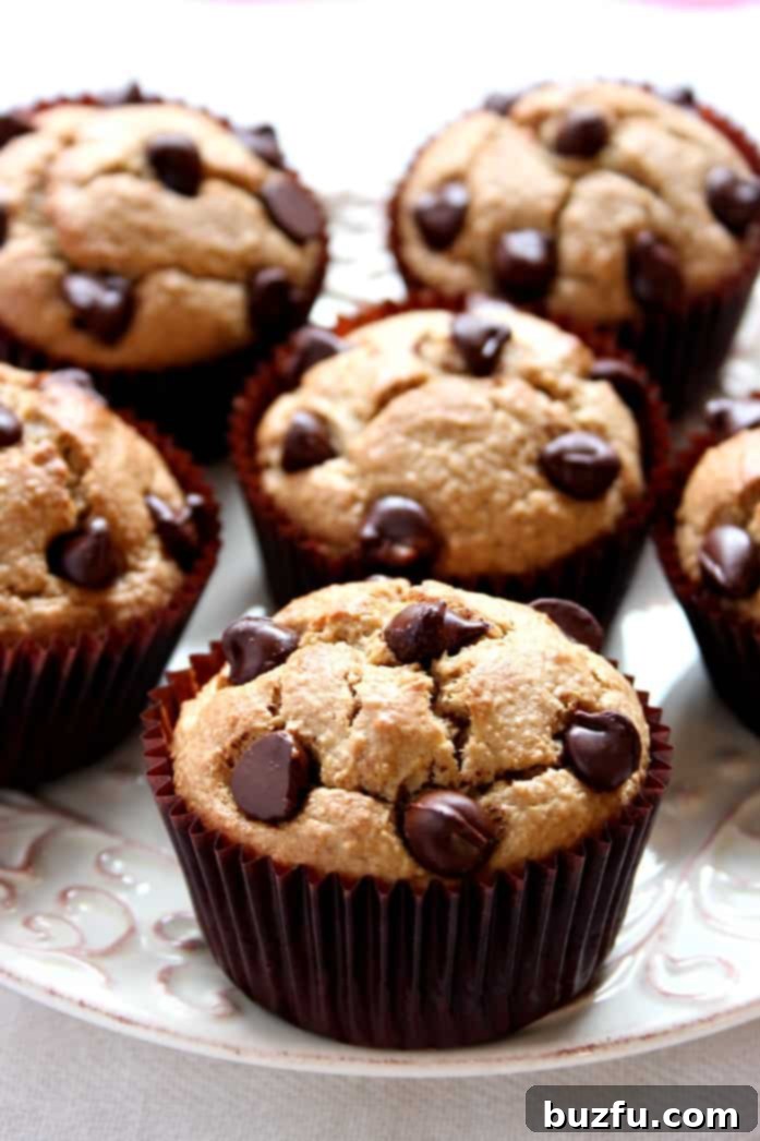 A stack of warm flourless peanut butter blender muffins, ready to eat.