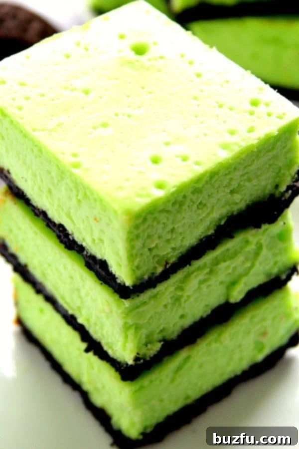 Stacked Mint Cheesecake Bars with a refreshing green hue, ready to be enjoyed.