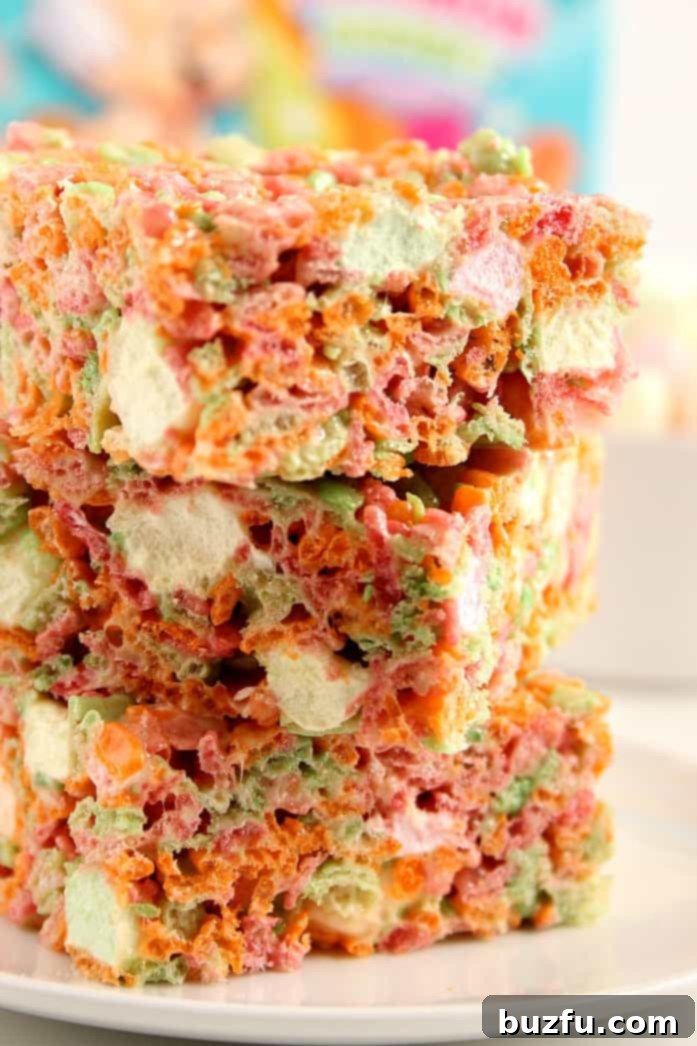 Delicious and colorful Ice Cream Pebbles Marshmallow Cereal Bars on a plate, ready to be enjoyed.