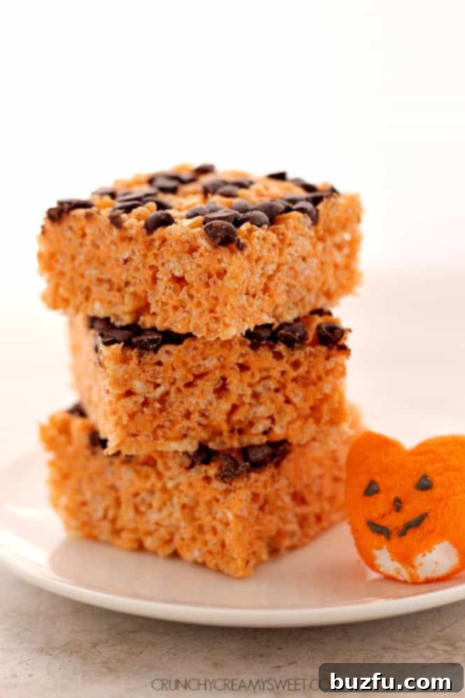 A festive platter of Pumpkin Spice Rice Krispies treats, garnished with sprinkles for a fall theme.