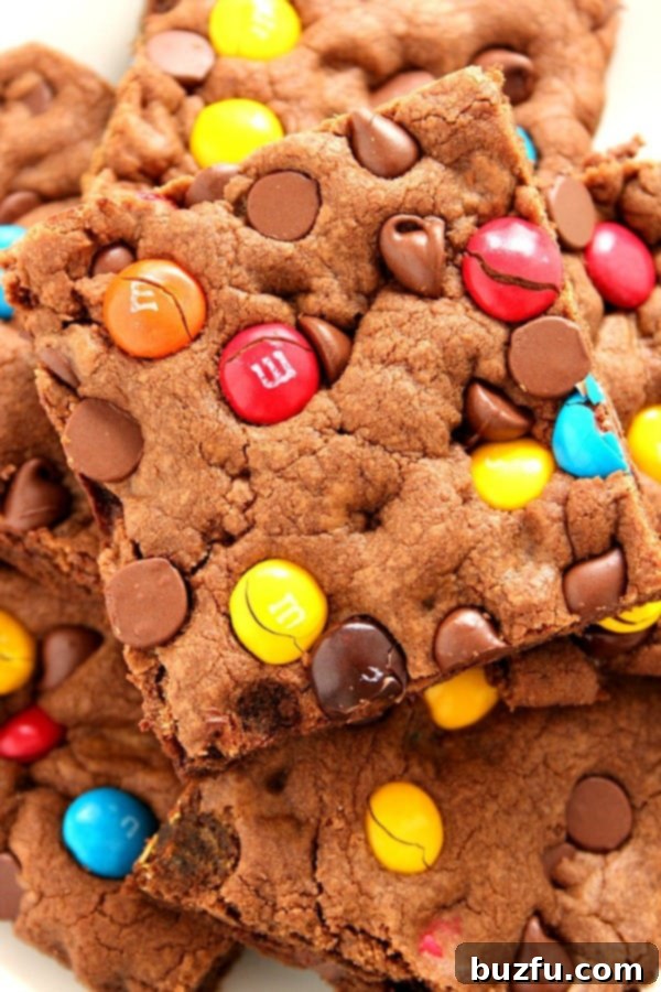 Plate of freshly baked Chocolate M&M Cookie Bars, showcasing their vibrant colors and chocolate chunks.