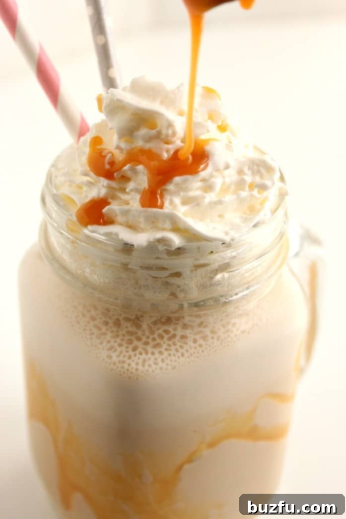 Easy Homemade Salted Caramel Frappuccino 3 Close-up of a homemade salted caramel frappe, showcasing the texture and toppings.