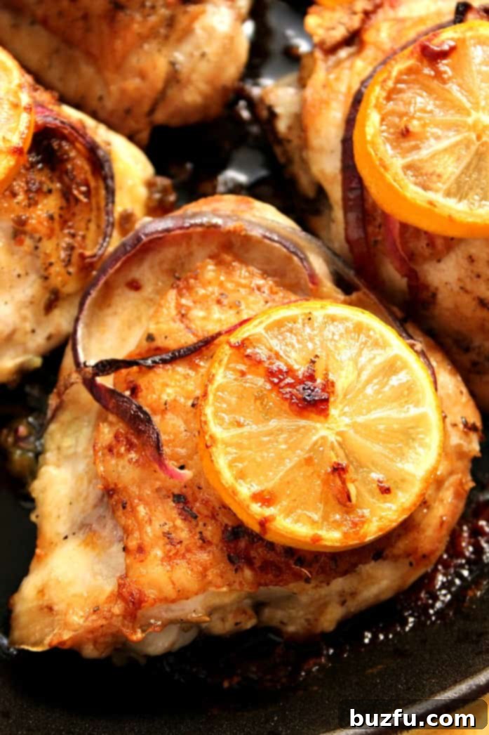 Lemon Garlic Roasted Chicken Thighs in cast iron skillet.