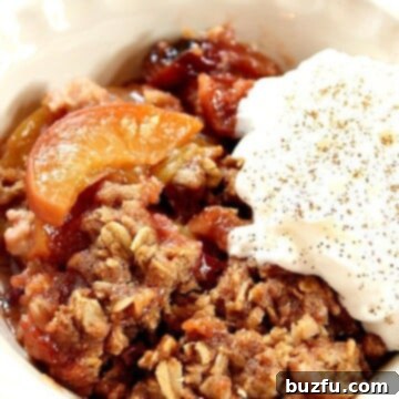 Slow Cooker Peach Crisp in a bowl with ice cream.