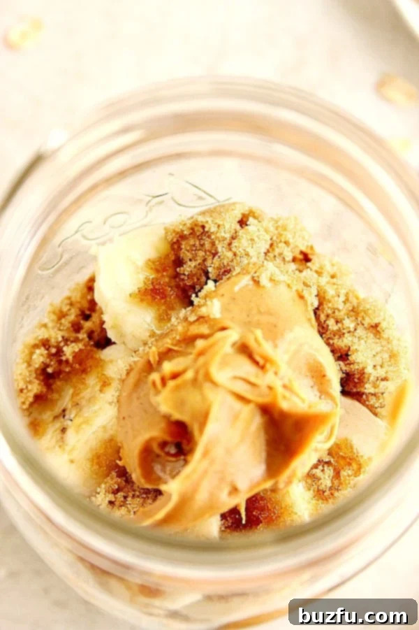 Overhead shot with peanut butter and brown sugar in glass jar.