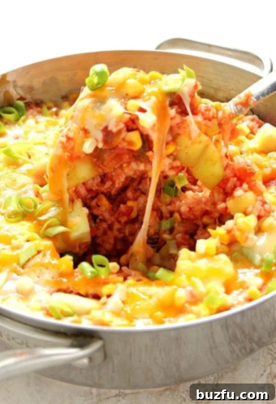 Delicious Cheesy Salsa Rice with Zucchini and Corn, a vibrant and flavorful side dish or main meal.