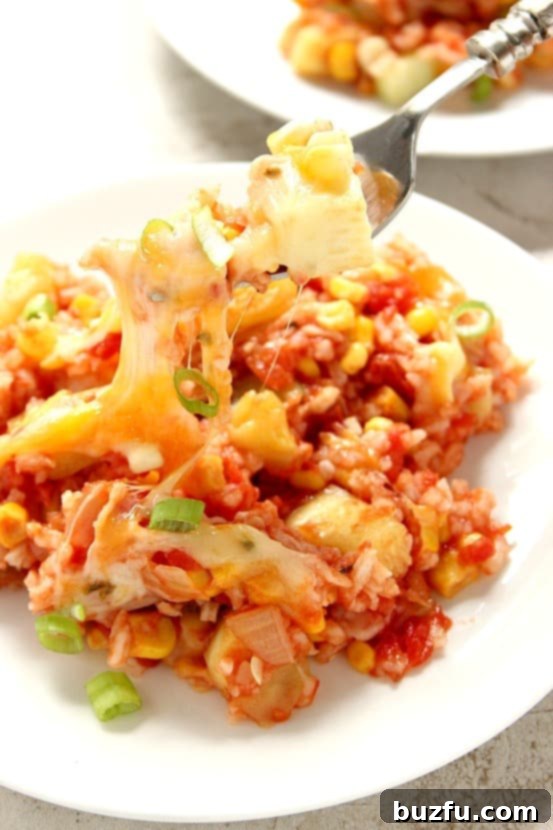 Cheesy Salsa Rice with Zucchini and Corn served in a bowl, ready to eat.