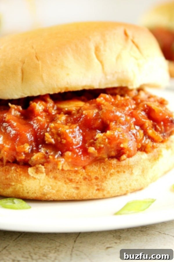 Side shot of Sloppy Joes mixture in bun.