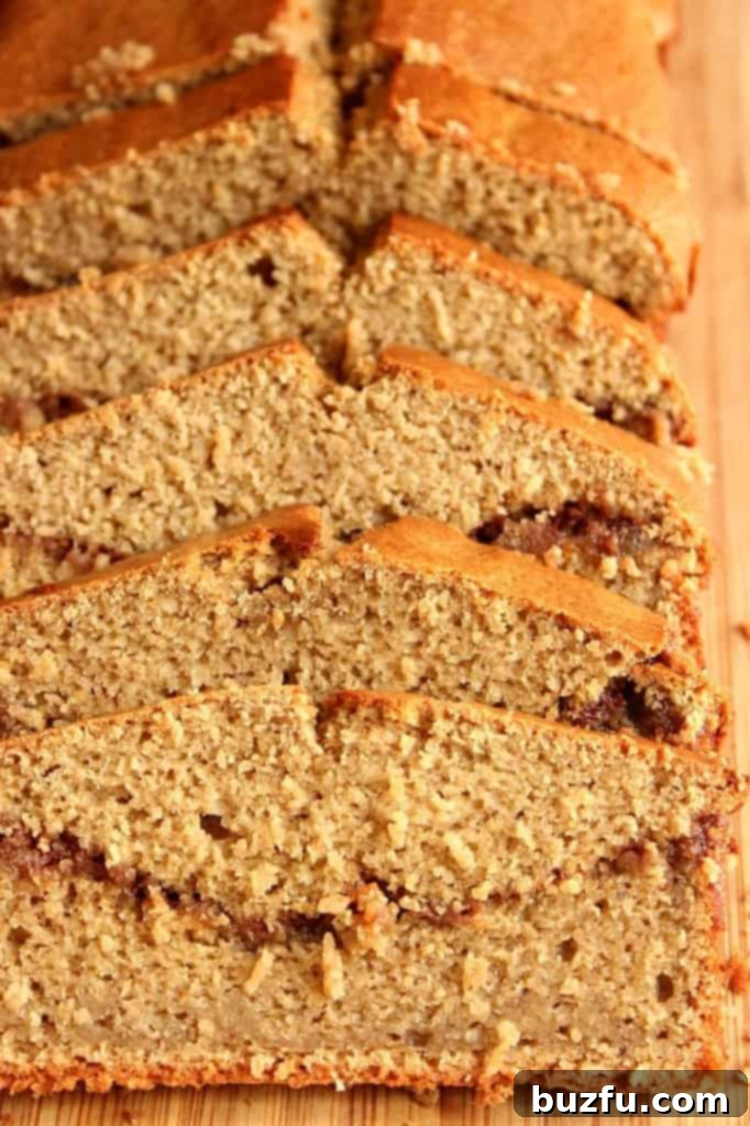 A whole loaf of Peanut Butter Banana Blender Bread, showing its golden crust and delicious swirl.