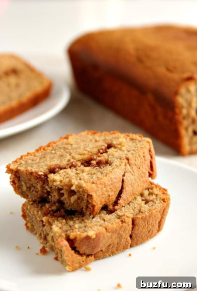 Close-up of a slice of Peanut Butter Banana Blender Bread, highlighting the cinnamon swirl.