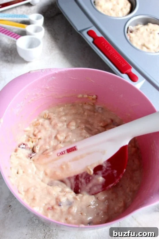 Apple Oat Cranberry Muffins recipe - fluffy and moist muffins with apple, oats and dried cranberries. Perfect addition to your lunchbox! 