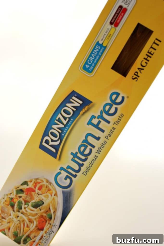 Ingredients for Healthy Gluten-Free Pasta Recipe Ingredients for turkey meatballs and garlic spaghetti laid out on a wooden board.