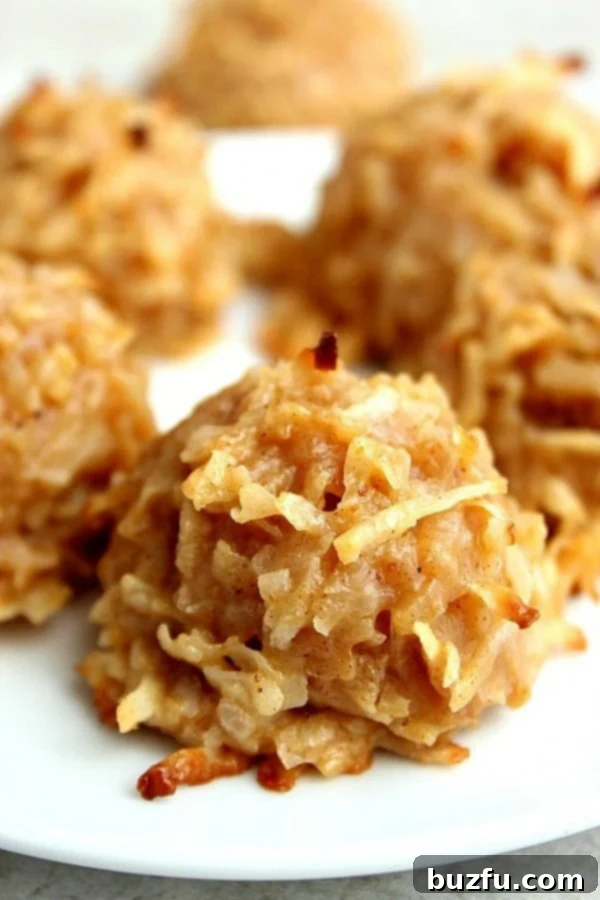 Delicious Pumpkin Spice Coconut Macaroons arranged beautifully on a plate, ready to be enjoyed.