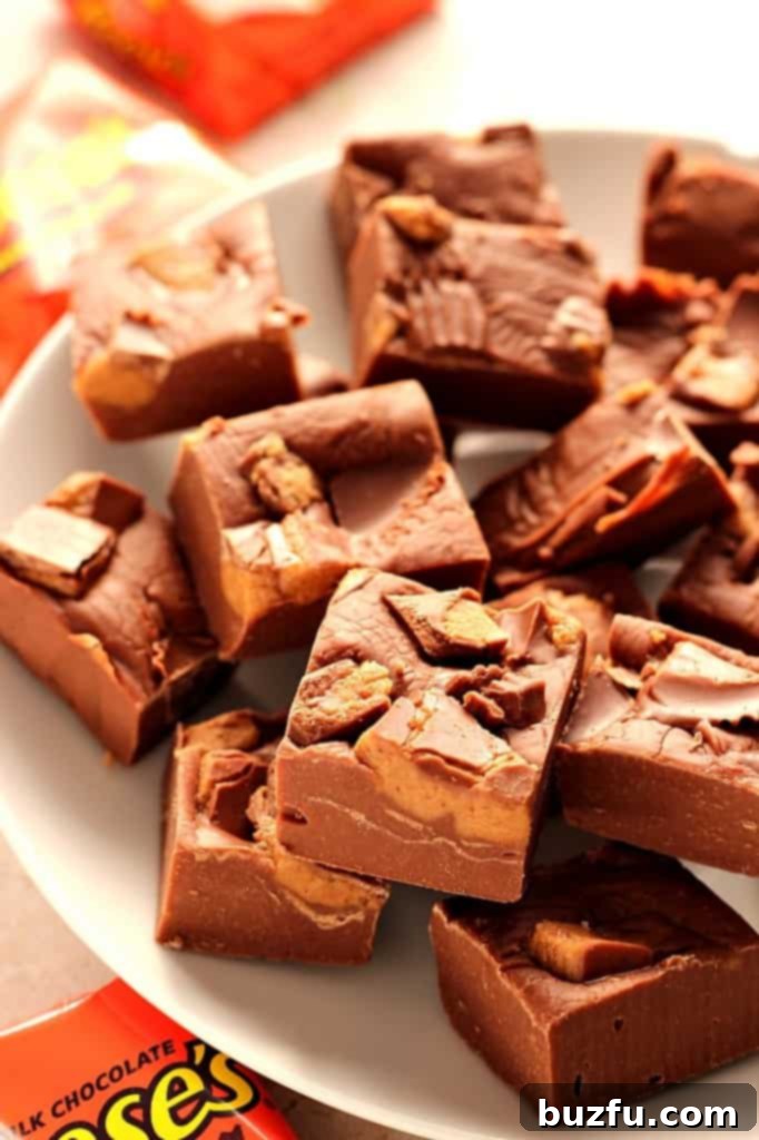 3-Ingredient Reese's Peanut Butter Cups Fudge Recipe - Easy and quick holiday treat for peanut butter and chocolate lovers.