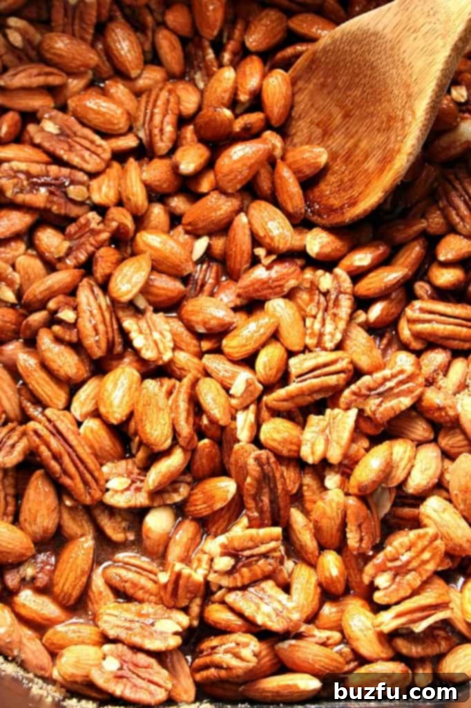 A close-up shot of the irresistible, perfectly coated Crock-Pot Candied Spiced Nuts.
