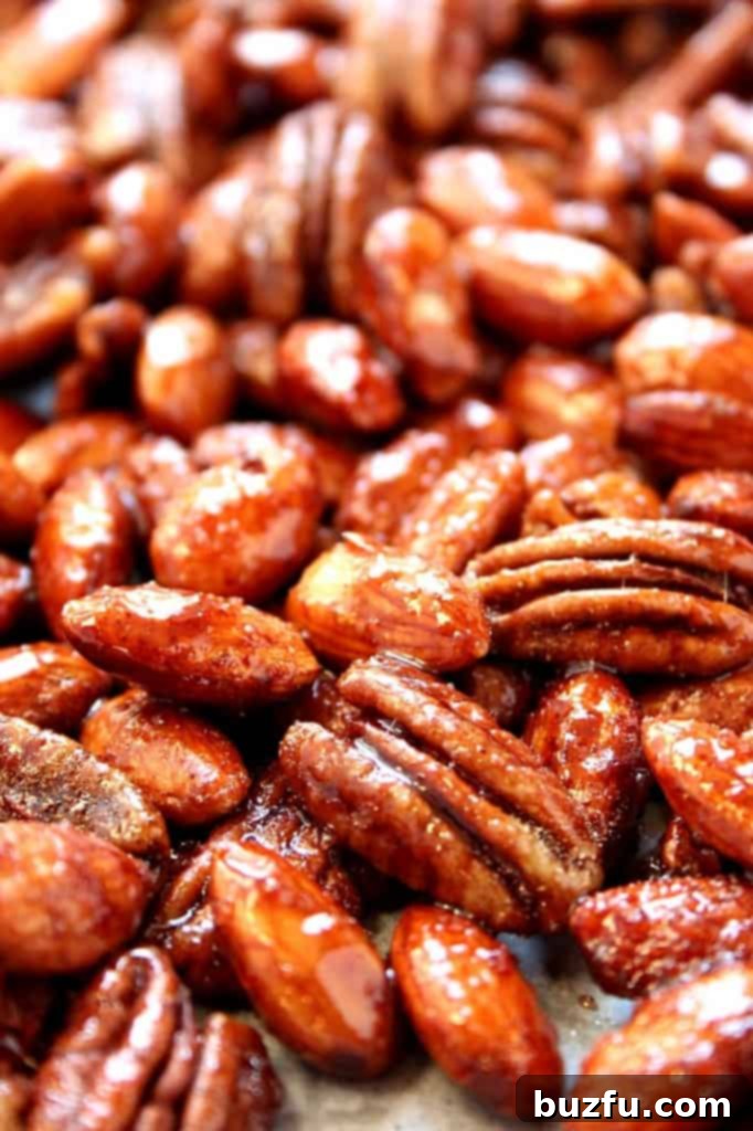 Crock-Pot Candied Spiced Nuts displayed in a decorative bowl, ready for serving.