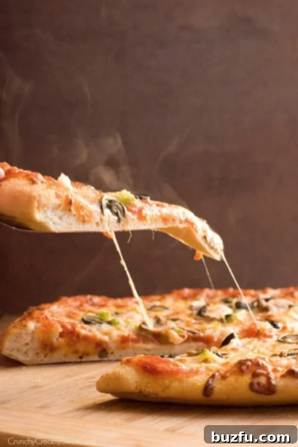 The Best Pizza Dough - a photo tutorial packed with tips on making the best pizza at home! A freshly kneaded pizza dough ball, perfectly smooth and ready for its first rise.