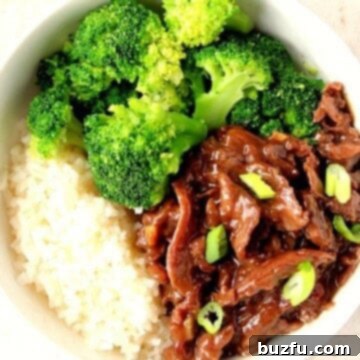 Mongolian Beef Rice Bowl with broccoli in white bowl.