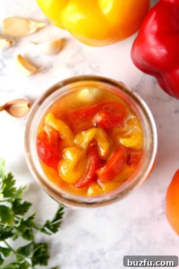 Marinated roasted red peppers in a jar, ready to be enjoyed.
