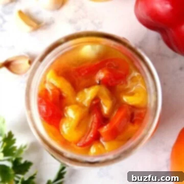 Marinated roasted red peppers in a jar.