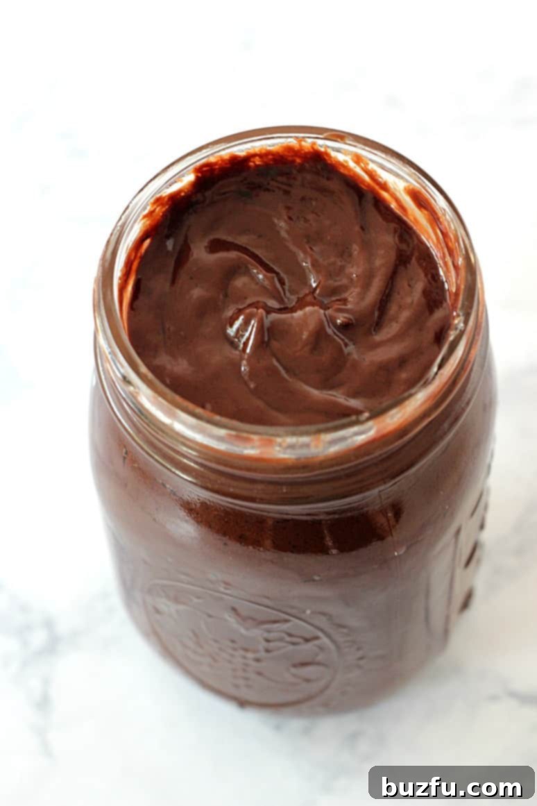 Peanut Butter Hot Fudge Sauce Recipe - quick and easy dessert topping. Perfect for ice cream, sundaes, cakes and cupcakes.