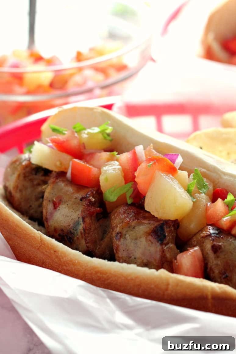 Flavorful Grilled Chicken Sausage with Zesty Pineapple Salsa – A Perfect Summer Meal for Picnics and BBQs.
