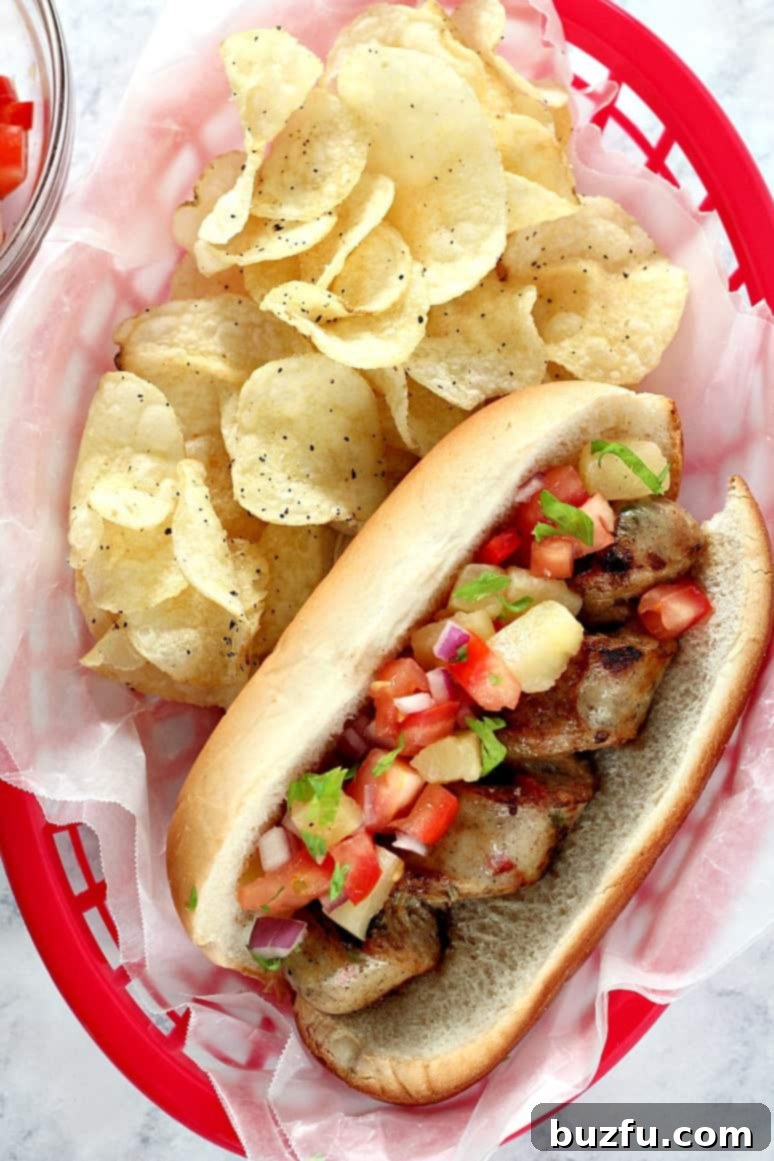 Delicious spiral-cut Grilled Chicken Sausage, topped with a vibrant and fresh Pineapple Salsa. Ideal for easy summer dinners.