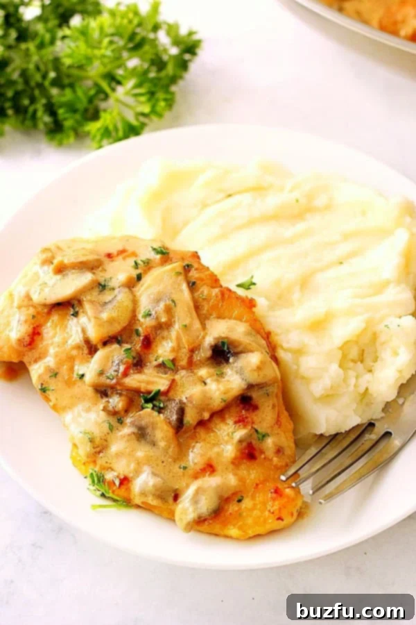 Close-up of creamy mushroom garlic chicken, showing the sauce and texture.