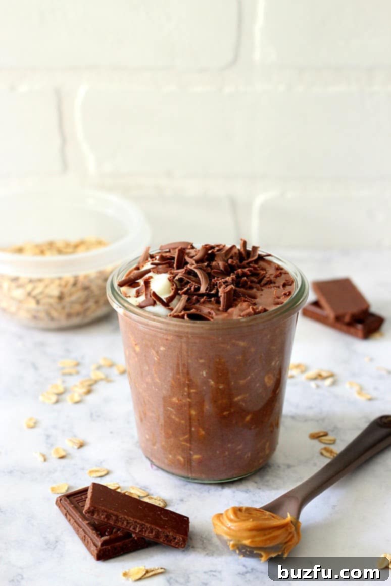 Close-up of Chocolate Peanut Butter Overnight Oats in a glass jar, showing layers and texture.