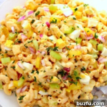 Deviled Egg Macaroni Salad on large white plate.