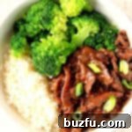 Mongolian Beef Rice Bowl with broccoli in a white bowl.