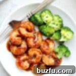 Honey Garlic Shrimp and broccoli arranged on a plate.